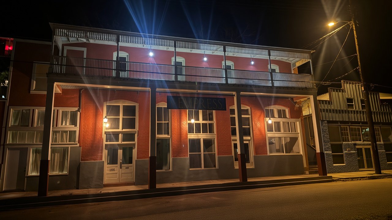 Night view under the balcony with warm lights at The Empress
