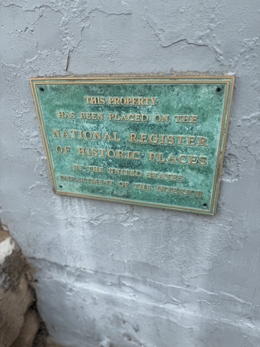 Bronze plaque on the building: This property has been placed on the National Register of Historic Places by the United States Department of the Interior